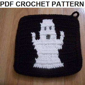 May include: A black and white crocheted ghost pot holder with a loop for hanging.