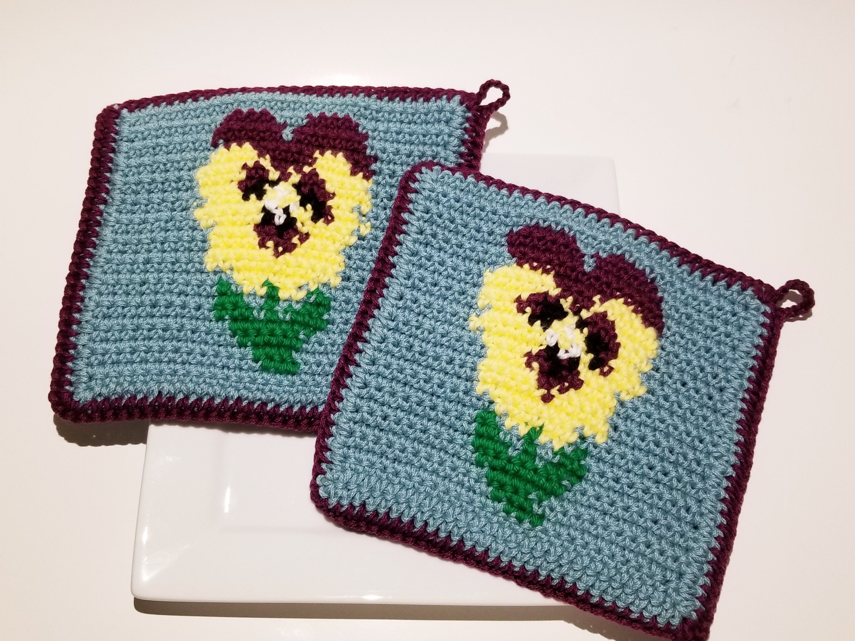 30 Pansy Crochet Patterns for Flowers, Decor, and Wearable Details 8 Pansy Potholder Crochet Pattern