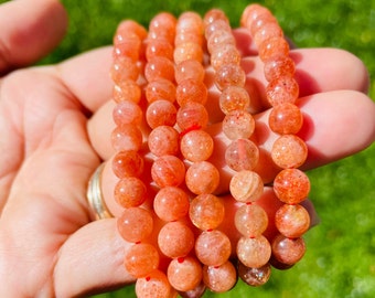 Arusha Sunstone Armband: Auffälliger oranger Glitzerkristall, XS Runde Perle
