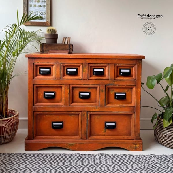 Vintage industrial style apothecary drawers painted orange