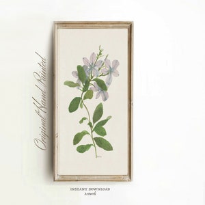 May include: A framed print of a watercolor painting of a purple flower with green leaves. The text "Original Hand Painted" is written vertically on the left side of the frame.