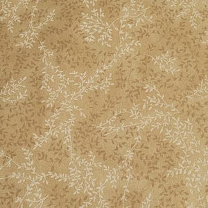 May include: A beige fabric with a white floral pattern. The pattern is a repeating design of small white leaves and branches.