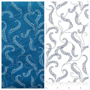 May include: A fabric swatch with a white paisley pattern on a teal blue background. The fabric is shown next to a white fabric swatch with the same paisley pattern in a dark blue color.