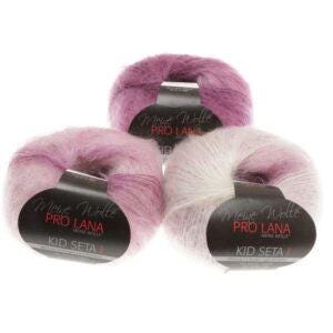 May include: Three balls of Kid Seta yarn in shades of pink and white. Each ball has a black label with the text "Meine Wolle PRO LANA KID SETA". The yarn appears soft and fluffy, suitable for knitting or crochet projects.