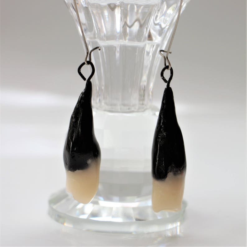 under black earring