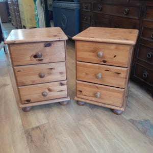 A Pair of solid pine bedside tables