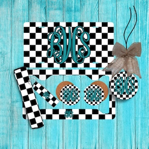 May include: A set of car accessories featuring a black and white checkered pattern with a monogram in teal. The set includes a license plate holder, a key chain, two coasters, and a car air freshener.