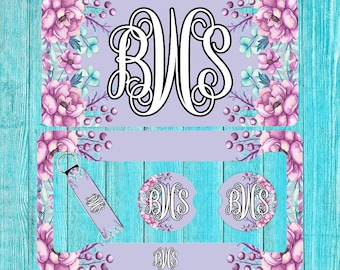May include: A set of personalized gifts featuring a floral design with a monogram of the letters "BWC". The set includes a license plate, two coasters, and a keychain.
