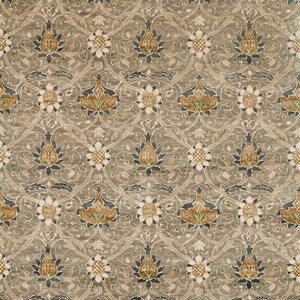 May include: A beige patterned rug with a repeating floral design. The rug features a variety of shades of brown, beige, and green.