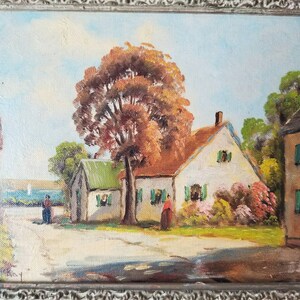 May include: A painting of a quaint countryside scene with two white houses, a large tree with orange leaves, and two figures walking on a dirt road. The sky is blue with white clouds.