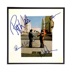 Réplica de la portada del álbum "Wish you were here" de Pink Floyd, firmada por David Gilmour y Roger Waters.
