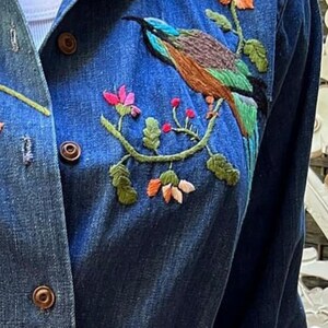 vintage 1970s embroidered denim chore jacket with pockets. Best fits S to M. Embroidery at chest and cuffs. image 2