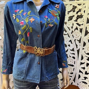 vintage 1970s embroidered denim chore jacket with pockets. Best fits S to M. Embroidery at chest and cuffs. image 1