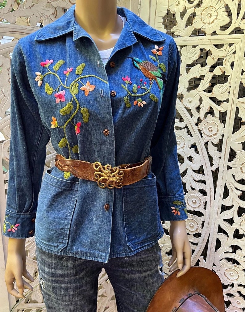 vintage 1970s embroidered denim chore jacket with pockets. Best fits S to M. Embroidery at chest and cuffs. image 1