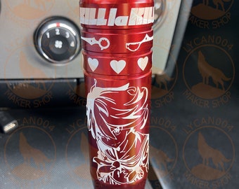 May include: Red metal gear shift knob with a white graphic of an anime character and the text "Kill la Kill".