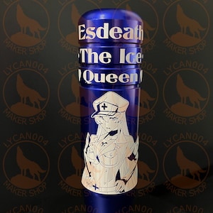 May include: A blue metal tumbler with a white design featuring a character with a white hat and a white cross on it. The text "Esdeath The Ice Queen" is printed on the tumbler.