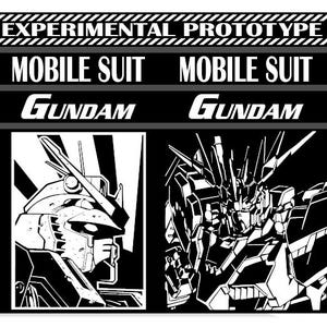 May include: Black shift knob with a cylindrical design. The image includes a black and white graphic with the text "EXPERIMENTAL PROTOTYPE MOBILE SUIT GUNDAM" and illustrations of Gundam robots.