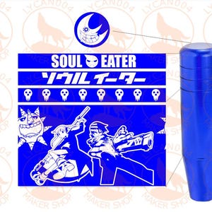 May include: A blue shift knob featuring the text "SOUL EATER" in English and Japanese, along with character illustrations. The knob is a solid, cylindrical shape with a smooth, glossy finish.