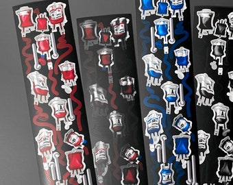 May include: Four sheets of stickers featuring various blood bag designs. Each sheet has a different color theme: red, black, blue, and pink. The stickers are arranged in a vertical row and feature different blood types, including A+, B+, AB+, and O+. The text on the sheets reads "SHOCKING PINK ROSE" and "2.700".