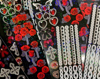 Juego de pegatinas de rosas góticas y adornos góticos: cadenas, murciélagos y rosas rojas.