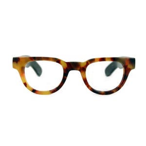 May include: Tortoise shell eyeglasses with round lenses and black arms.