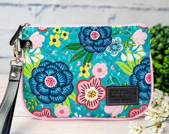 Clutch handbag with 6 card slots, and 1 slip pocket for documents. Wristlet purse made of Cotton with Flowers print and piping for structure
