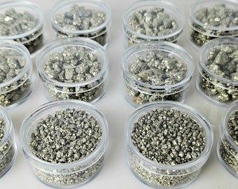 Pyrite crystals in display case