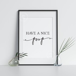 May include: A black and white printable wall art print with the text "Have a nice poop" in a cursive font.