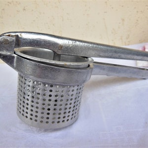 Vintage potato  press  ,  Potato press