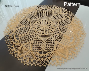 May include: A beige crocheted doily with a delicate floral pattern. The doily is oval shaped and has a diameter of approximately 12 inches.
