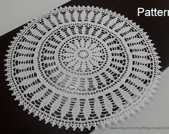 May include: White crochet doily with a delicate floral pattern. The doily is round and has a diameter of approximately 12 inches.
