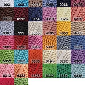 May include: A color chart of embroidery floss with a variety of colors, including white, black, red, blue, green, yellow, and pink. The chart is organized by color number, with the numbers printed on each square.