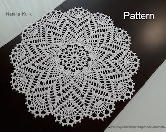 May include: A white crochet doily with a delicate floral pattern. The doily is circular and has a diameter of approximately 30 cm. The pattern is intricate and features a variety of stitches. The doily is perfect for adding a touch of elegance to any home.