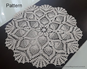 May include: A white crochet doily with a delicate floral pattern. The doily is circular and has a diameter of approximately 46 cm.