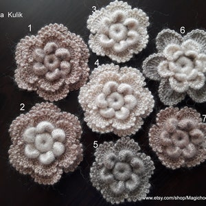 May include: Seven crocheted flowers in various shades of brown, beige, and gray. The flowers are numbered 1 through 7.