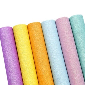 May include: Six rolls of glitter fabric in various pastel colors, including lavender, yellow, orange, light blue, pink, and teal.