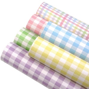May include: Five rolls of faux leather fabric with a checkered pattern in various pastel colors, including purple, green, yellow, blue, and pink.