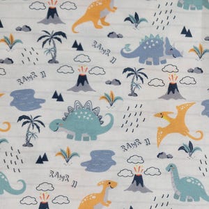 May include: A white fabric with a repeating pattern of dinosaurs, volcanoes, palm trees, and clouds. The dinosaurs are in shades of blue and orange. The text "RAWR II" is scattered throughout the design. This fabric is suitable for various sewing projects.