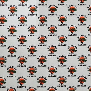 Stretchy Dojo Logo Small Scale Cotton Lycra Fabric by the Yard or 1/2 yard or Fat Quarter or Tumbler Cut, Martial Arts, Grey background