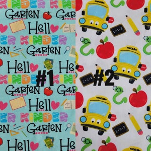 May include: Two fabric swatches with different patterns. The first swatch is light blue with a repeating pattern of the words "Garten", "Kinder", and "Hello" in black, along with red apples, pencils, and other school-related items. The second swatch is white with a repeating pattern of yellow school buses, red apples, pencils, and green snakes. Both swatches have the number "#1" and "#2" written on them.