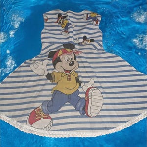 Girls twirling vintage disney mickey mouse upcycled dress age 3 years