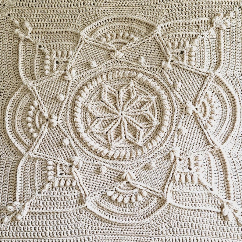 Crochet afghan on a bed.