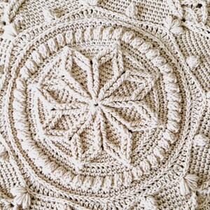 Crochet blanket on queen-size bed.