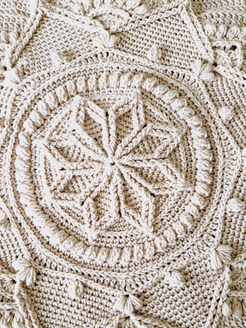 Crochet blanket on queen-size bed.