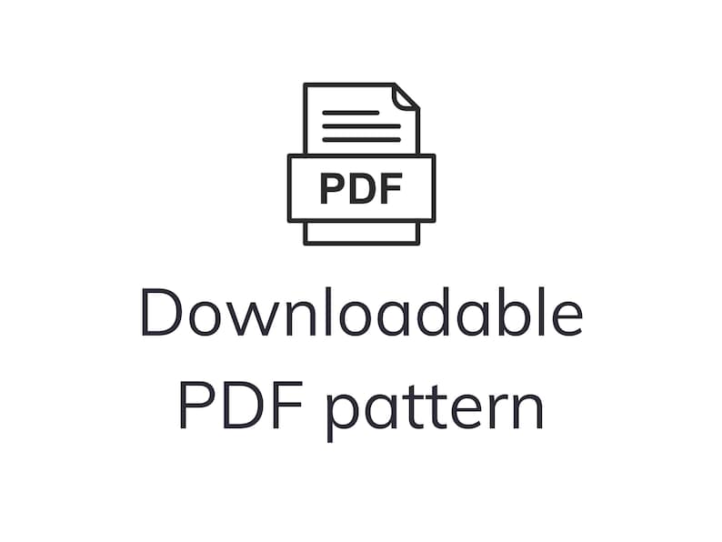 May include: A black and white graphic of a PDF icon above the words "Downloadable PDF pattern". The PDF icon is a stack of papers with the letters "PDF" in a box. The text is in a clean, sans-serif font.