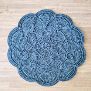 Floral, blue crochet floor rug.