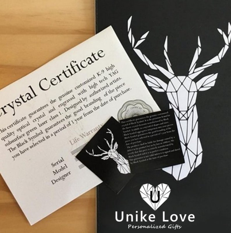 May include: A black and white geometric deer design on a black background. The image includes a certificate with the text "Crystal Certificate" and a small card with the text "Unike Love Personalized Gifts".