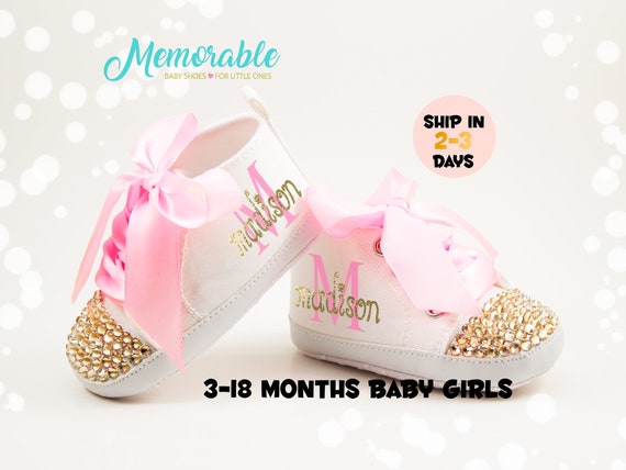 pink and gold baby shoes