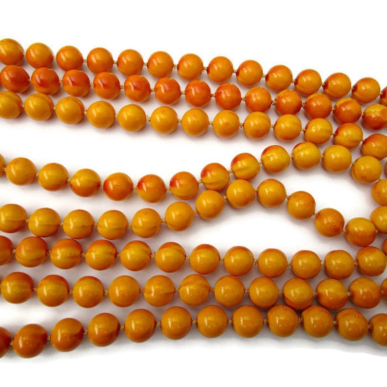 flapper style Vintage long yellow multi strand bead necklace