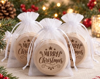 May include: Three round wooden ornaments inside individual white sheer organza drawstring bags. Each ornament features the laser-engraved text Merry Christmas, accented with stars and candy cane illustrations in a dark brown finish.